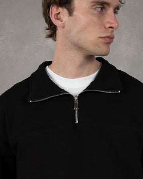 Black quarter-zip sweatshirt